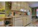 Traditional kitchen features white cabinets, ample counter space, and modern appliances at 1248 Rockview Ct, Loganville, GA 30052