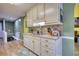 Traditional kitchen with matching countertops, white cabinets and appliances offering a functional cooking space at 1248 Rockview Ct, Loganville, GA 30052