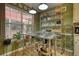Well-organized kitchenette with metal shelving, cooking essentials, and bright natural light for efficient meal preparation at 1248 Rockview Ct, Loganville, GA 30052
