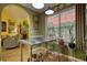 Charming kitchenette area with stainless steel island, plants, and view into the cozy living room at 1248 Rockview Ct, Loganville, GA 30052