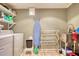 Functional laundry room includes a washer, dryer, and utility sink with a faucet at 1248 Rockview Ct, Loganville, GA 30052