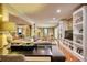 Spacious living room featuring hardwood floors, gray sofa, built-in bookcases, and abundant natural light at 1248 Rockview Ct, Loganville, GA 30052
