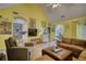 Inviting living room with a view into kitchen, showcasing comfortable seating, and ample natural light at 1248 Rockview Ct, Loganville, GA 30052