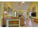 Well-lit living room with a stone fireplace, comfortable seating, and a view of the backyard for serene relaxation at 1248 Rockview Ct, Loganville, GA 30052