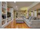 Inviting living room with stylish furnishings, built-in bookcases, and rich hardwood floors throughout at 1248 Rockview Ct, Loganville, GA 30052