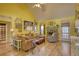 Bright and inviting living room with wood floors, comfortable seating, stone fireplace, and vaulted ceiling at 1248 Rockview Ct, Loganville, GA 30052