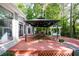 Relaxing deck with a gazebo, outdoor furniture, and lush greenery, perfect for gatherings at 2639 Hummingbird Nw Dr, Duluth, GA 30096