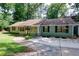 Charming single-story home featuring a cozy front patio and well-maintained landscaping at 2639 Hummingbird Nw Dr, Duluth, GA 30096
