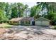 Charming home featuring a spacious driveway, attached two-car garage, and a beautiful, wooded lot at 2639 Hummingbird Nw Dr, Duluth, GA 30096