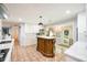 Elegant kitchen featuring a unique wooden island, white cabinets, and modern appliances at 2639 Hummingbird Nw Dr, Duluth, GA 30096