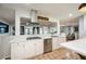 Contemporary kitchen featuring stainless steel appliances, white cabinets, and an open layout at 2639 Hummingbird Nw Dr, Duluth, GA 30096