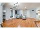 Living room with wood floors, stylish lighting, and comfortable seating, with French doors leading outside at 2639 Hummingbird Nw Dr, Duluth, GA 30096