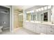 Bright bathroom with a double vanity, a walk-in shower, and plenty of cabinet space at 2639 Hummingbird Nw Dr, Duluth, GA 30096