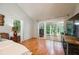 Well-lit main bedroom with wood floors, access to a sunroom, and ample closet space at 2639 Hummingbird Nw Dr, Duluth, GA 30096