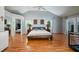 Spacious main bedroom featuring vaulted ceilings, wood floors, and ample natural light at 2639 Hummingbird Nw Dr, Duluth, GA 30096