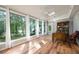 Sunlit office space with large windows overlooking the lake and a classic wooden desk at 2639 Hummingbird Nw Dr, Duluth, GA 30096