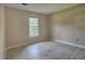 Bright bedroom with neutral walls, wood-look flooring, and a large window at 4512 Woodlawn Lake Dr, Marietta, GA 30068