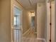 Upstairs hallway with wood-look floors leads to bedrooms and other rooms at 4512 Woodlawn Lake Dr, Marietta, GA 30068