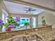 Elegant kitchen featuring granite countertops, stainless steel sink, and views of the backyard at 4512 Woodlawn Lake Dr, Marietta, GA 30068