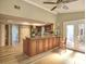 Open kitchen featuring a granite counter bar area, hardwood floors, and stainless appliances at 4512 Woodlawn Lake Dr, Marietta, GA 30068