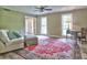 Inviting living room features a colorful rug, comfortable seating, and ample natural light at 4512 Woodlawn Lake Dr, Marietta, GA 30068