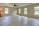 Spacious living room with several windows and hardwood floors at 4512 Woodlawn Lake Dr, Marietta, GA 30068