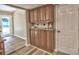 Pantry area with granite counters, wood cabinets and nearby back door at 4512 Woodlawn Lake Dr, Marietta, GA 30068