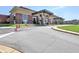 Brick school building with multiple entrances, landscaping, and a spacious parking area at 4512 Woodlawn Lake Dr, Marietta, GA 30068
