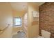 A quaint bathroom with a shower, toilet, and small cabinet for storage at 6880 Mark Turner Rd, Lithia Springs, GA 30122