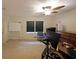 Home office space features a whiteboard, two windows, and office furniture, with ample lighting at 6880 Mark Turner Rd, Lithia Springs, GA 30122