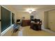 Bright home office features two windows, neutral paint, desk with computer, and ample natural light at 6880 Mark Turner Rd, Lithia Springs, GA 30122