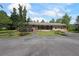 Charming one-story home featuring stone accents, mature landscaping, and an expansive front yard at 6880 Mark Turner Rd, Lithia Springs, GA 30122
