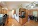 Spacious kitchen featuring black countertops, stainless steel appliances, and classic wood cabinets at 6880 Mark Turner Rd, Lithia Springs, GA 30122