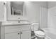 Bright bathroom featuring a white vanity with a modern mirror and a shower/tub combo at 2793 Keystone Ave, Lithonia, GA 30058