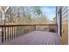 Spacious wooden deck with railing, perfect for outdoor entertaining with treed background at 2793 Keystone Ave, Lithonia, GA 30058