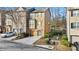 Charming two-story townhome with neutral siding, attached garage, and well-manicured landscaping at 2793 Keystone Ave, Lithonia, GA 30058