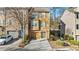 Charming two-story townhome with neutral siding, attached garage, and well-manicured landscaping at 2793 Keystone Ave, Lithonia, GA 30058
