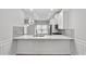 A modern eat-in kitchen with quartz countertops and stainless steel appliances at 2793 Keystone Ave, Lithonia, GA 30058