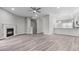 An open-concept living room with a fireplace flows into the eat-in kitchen area at 2793 Keystone Ave, Lithonia, GA 30058