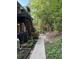 A charming outdoor area with lush greenery, a stone pathway, and a pergola at 425 Lindbergh Ne Dr # A2, Atlanta, GA 30305