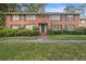 Beautiful brick two-story home with well-maintained landscaping, lush greenery, and a charming front entrance at 425 Lindbergh Ne Dr # A2, Atlanta, GA 30305