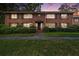 Beautiful brick two-story home with well-maintained landscaping, lush greenery, and a charming front entrance at 425 Lindbergh Ne Dr # A2, Atlanta, GA 30305