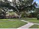 Charming brick apartment building nestled among mature trees and a meticulously maintained lawn and sidewalks at 425 Lindbergh Ne Dr # A2, Atlanta, GA 30305