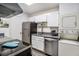 Efficient kitchen with stainless steel appliances and bright white cabinets at 425 Lindbergh Ne Dr # A2, Atlanta, GA 30305
