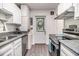 Efficient kitchen with stainless steel appliances and bright white cabinets at 425 Lindbergh Ne Dr # A2, Atlanta, GA 30305