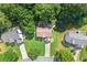 Aerial shot of a well-maintained home with lush greenery and a long driveway at 7505 Brookwood Way, Cumming, GA 30041