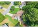 Aerial view of house with a lush backyard and patio area at 7505 Brookwood Way, Cumming, GA 30041