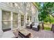 Inviting back deck with patio furniture, offering a relaxing outdoor space overlooking the yard at 7505 Brookwood Way, Cumming, GA 30041