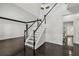 Grand foyer featuring a staircase with dark wood floors and white trim at 7505 Brookwood Way, Cumming, GA 30041