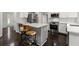 Modern kitchen with stainless steel appliances, a gas range, and a cozy island with seating at 7505 Brookwood Way, Cumming, GA 30041